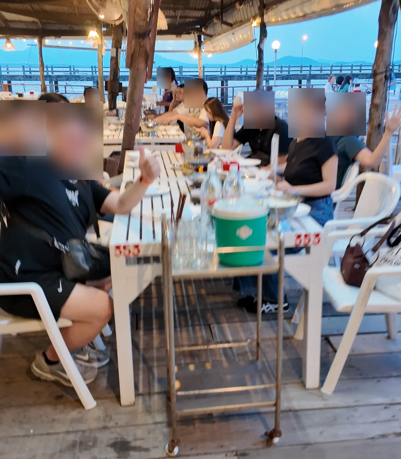 GGM travelers enjoying a seaside group dinner in Thailand