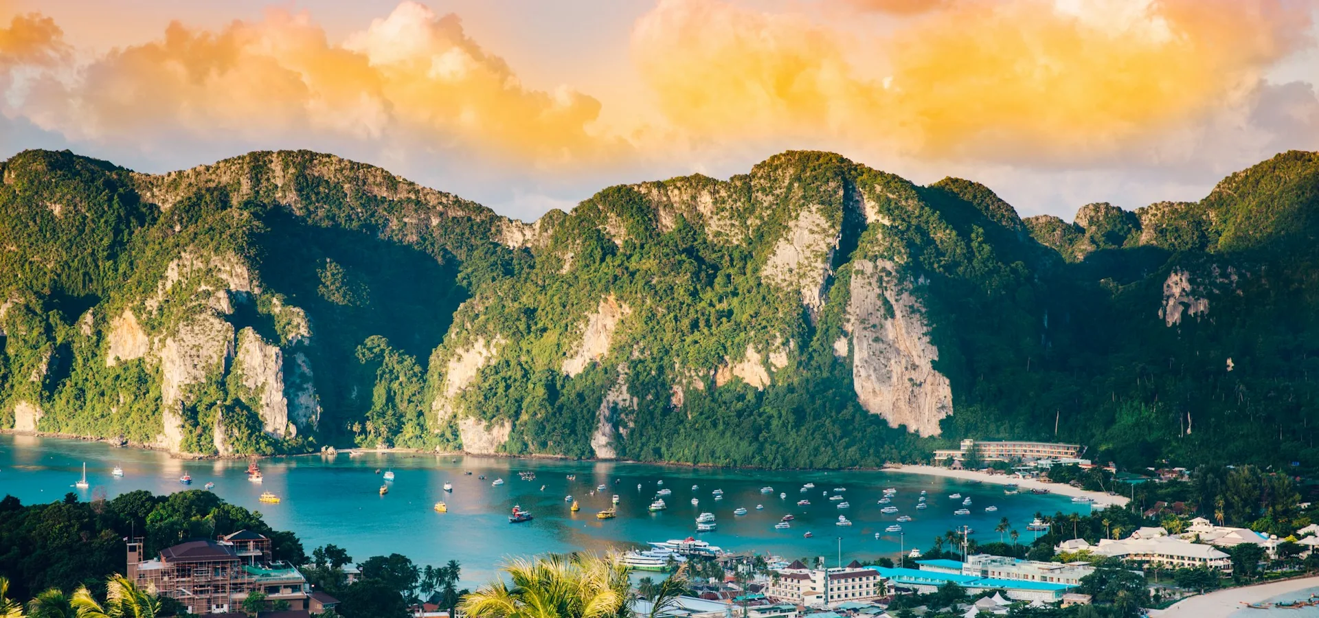 Turquoise bay and limestone cliffs at golden hour