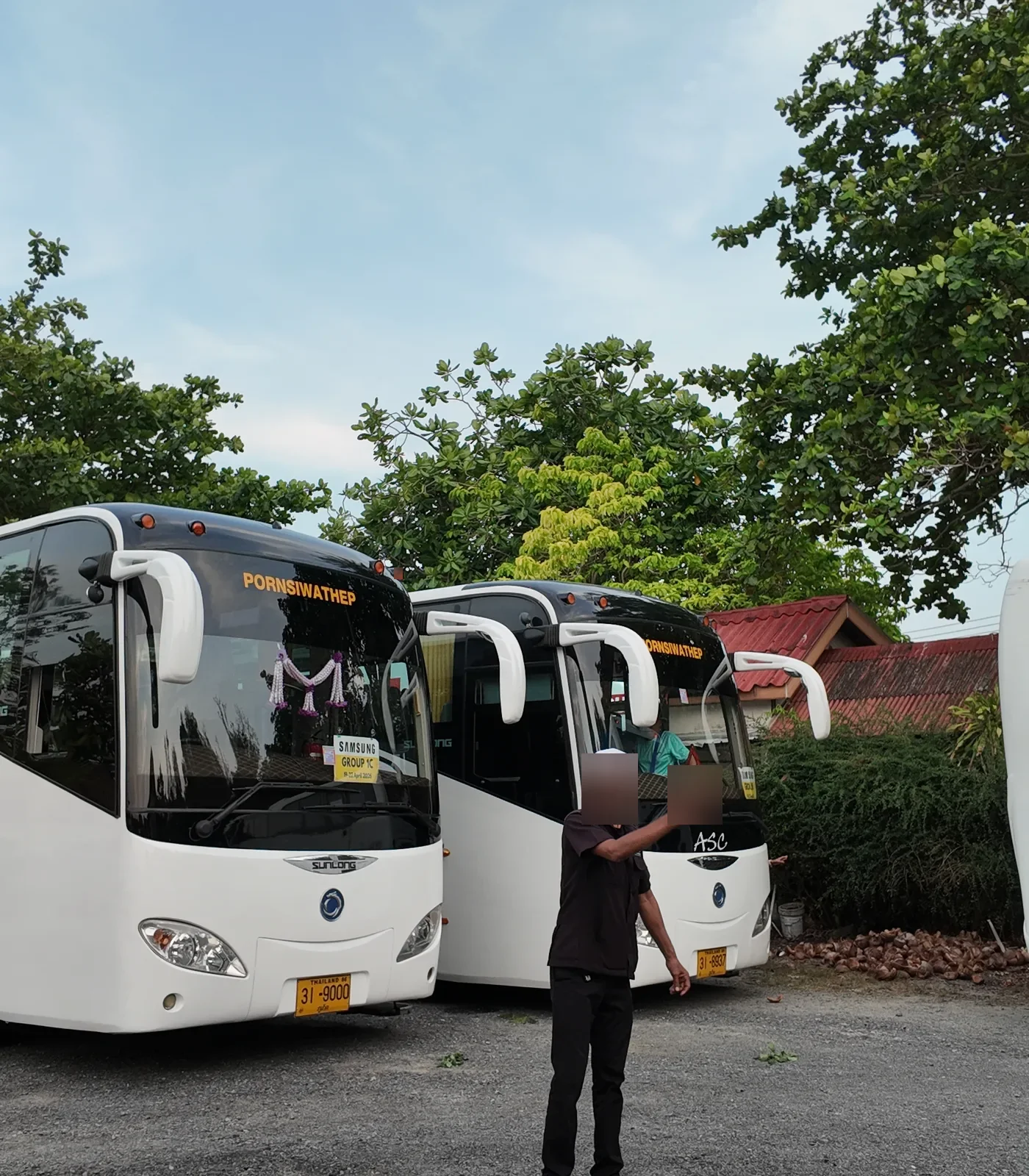 Coach driver welcoming passengers